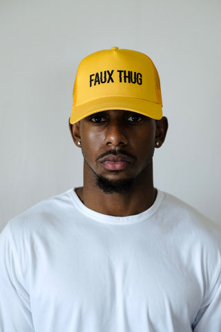 TRUCKER HAT YELLOW | BLACK LOGO